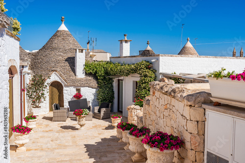 Famous historic dry stone trullo house with conical roof in Alberobello, Italy.