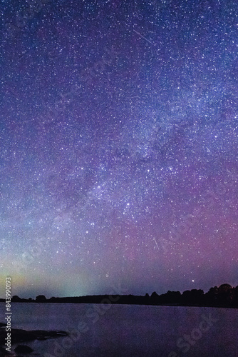 Lagoon at starry night with windmills on the shore, Laguna de los Gamboa in Monte Escobedo, Zacatecas