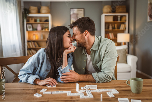 boyfriend and girlfriend play dominoes at home have fun together