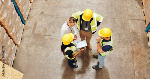 Employee, warehouse and above with tablet for teamwork, collaboration and planning. People, conversation and briefing for logistics at factory with manufacturing, supply chain and distribution