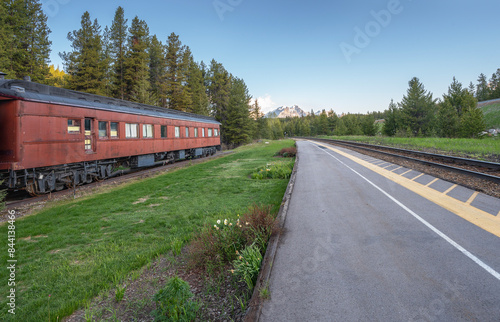 Train tracks and historic passenger train car at the Lake Louise Train Station in Banff National Park, Alberta, Canada