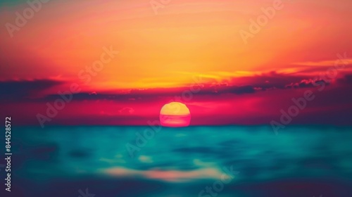 As the sun dips below the horizon the colors of the sky transform into a blend of warm and cool tones resulting in a defocused background of vibrant sunset hues. .