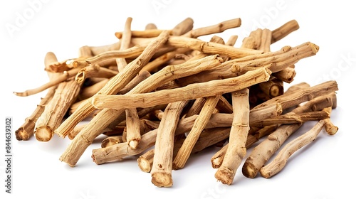 Close-up of dried ashwagandha roots with earthy texture isolated on white background