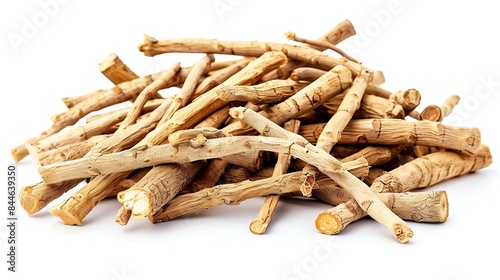 Close-up of dried ashwagandha roots with earthy texture isolated on white background
