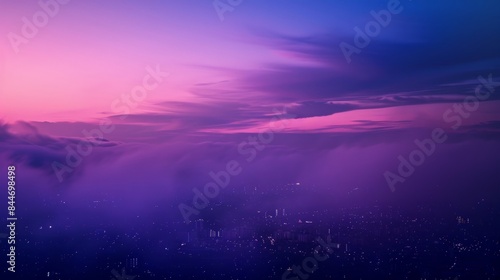 The defocused layers of deep purples and blues create a sense of enchantment as the sky fades into the distance highlighting the urban landscape below. .