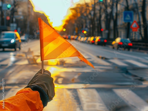 Hand holding traffic flag, Daylight Photography, in direct angle view, cinematic and photorealistic style