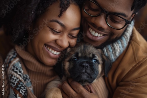 Love, photo, and black couple with dog at Animal Shelter for Kennel Adoption. Support, caring, or loving multiracial couple bonding with foster puppy or pet and enjoying time together