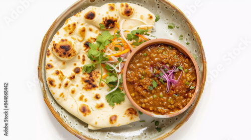 Top view of dal with tandoori roti in plate isolated on white background 