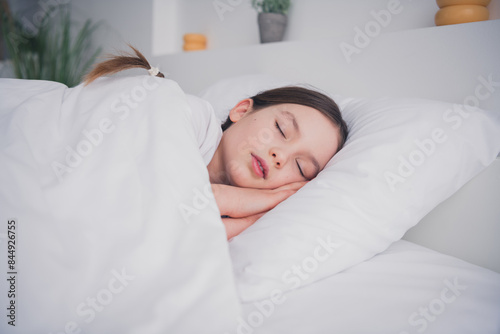 Portrait of adorable lovely little girl sleeping comfy bedroom sweet dreams white light room interior indoors