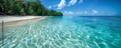 Tropical beach with crystal-clear water