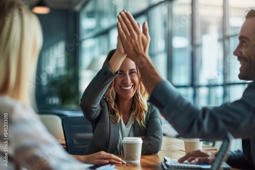 Businesswoman giving a high five to male colleague in meeting. ai generated