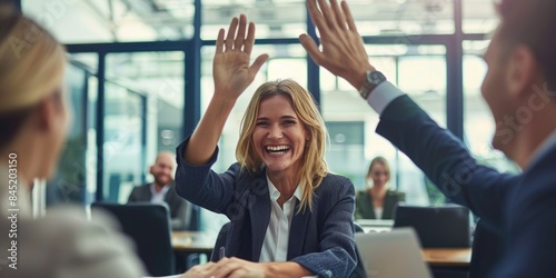 Businesswoman giving a high five to male colleague in meeting. ai generated