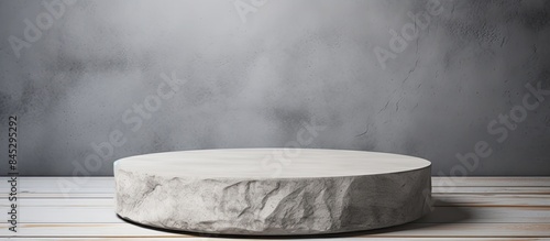 A podium made of gray cement acts as the background for showcasing products It features a stand with a gray concrete stone backdrop providing copy space for displaying product presentation mock ups t