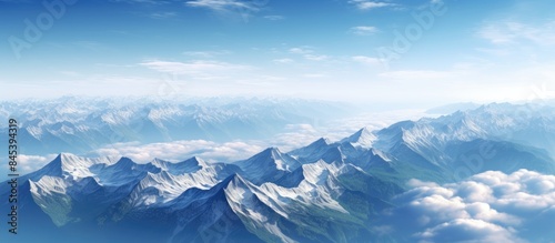 View of snowcapped peaks in the Alps Mountain range with pastures below Valley of Savoie in summer seen from above. Creative banner. Copyspace image