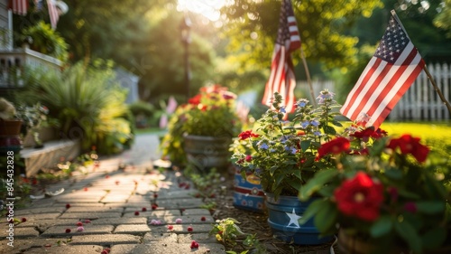 Sunlit garden with American flags, flowers bloom along brick path