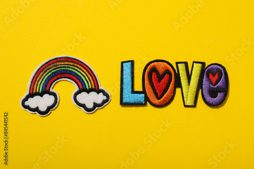 LGBT parade concept, free love symbol on yellow background.