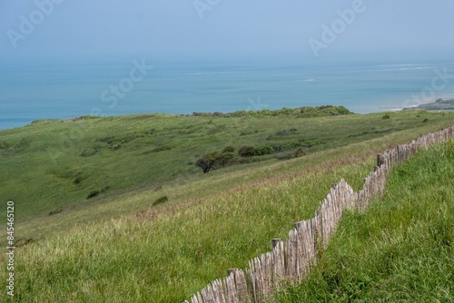 fence at steep coast at cap blanc nez france