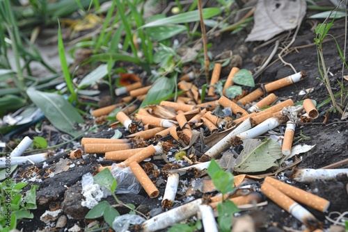 Pollution detail showing discarded cigarette butts on the ground