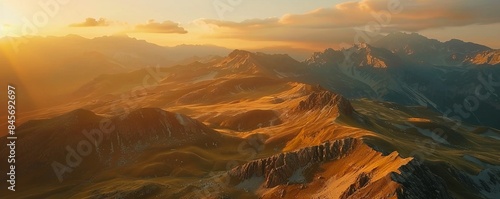 Majestic mountain range bathed in golden sunlight, 4K hyperrealistic photo