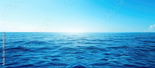 Vivid blue ocean under a clear sky with room for text.