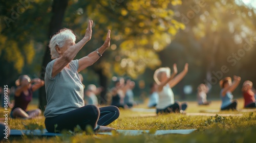 Outdoor fitness training, a group of elderly grandmothers doing yoga in the park