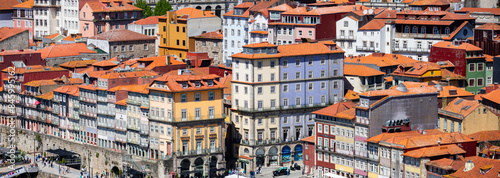 Panoramic view of UNESCO world heritage site Porto city in Portugal during sunny day with blue sky.