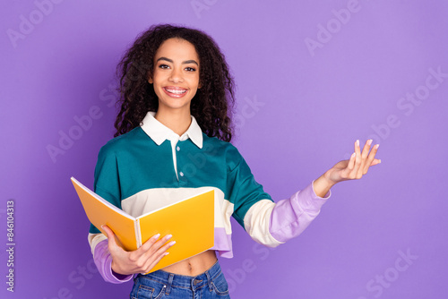 Photo of nice young girl hold book read wear shirt isolated on violet color background
