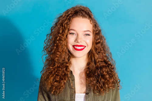 Portrait of pretty young woman beaming smile wear khaki shirt isolated on turquoise color background