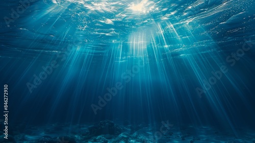 a photorealistic deep blue sea texture, with sunlight rays penetrating through the water, creating a mesmerizing underwater world. ,