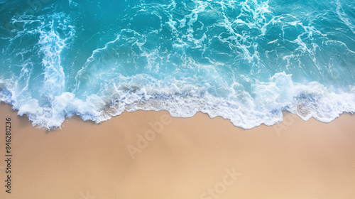 Ocean waves on the beach, clear blue water, high view