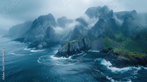 Drone shot of the dramatic cliffs and sea stacks at Værøy in the Lofoten Islands, Norway