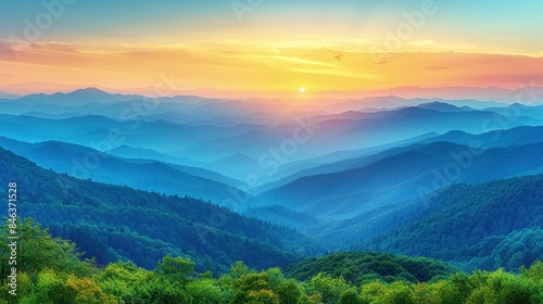 Breathtaking sunrise over misty blue mountains, with vibrant colors and layered peaks, creating a serene and peaceful natural landscape.