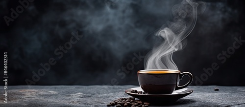 A cup of espresso with steam rising above it on a black stone background The image has copy space for text The close up shot beautifully captures the shallow depth of field creating an inviting scene
