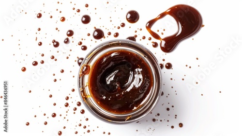 Overhead shot of Hoisin Sauce jar with sauce spilling out slightly, highlighting its rich color and viscosity, isolated background