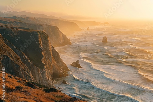 A stunning panoramic view of a rugged coastline at sunset with waves crashing against the cliffs