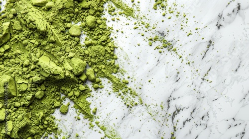 Smattering of vibrant green matcha powder scattered over a white marble surface, creating a striking contrast and visual texture.