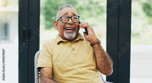 Home, phone call and funny with senior man, communication and network with joke, digital app and smile in living room. Pensioner, apartment and happy mature guy with smartphone, humor and laughing