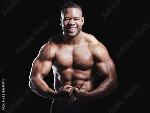 Portrait, flexing muscle and black man in studio with arms for training, workout routine or biceps on dark background. Strong, wellness and shirtless bodybuilder for confidence, arm growth or fitness