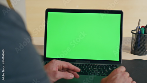 Boss hand swiping touchpad on chromakey laptop starting lesson at home zoom on