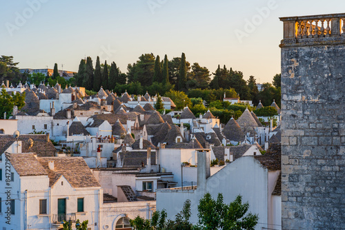 View of the famous traditional old dry stone trulli houses with conical roofs in Alberobello, Italy.