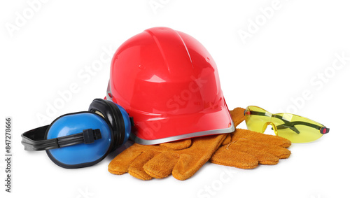 Hard hat, gloves, earmuffs and protective goggles isolated on white