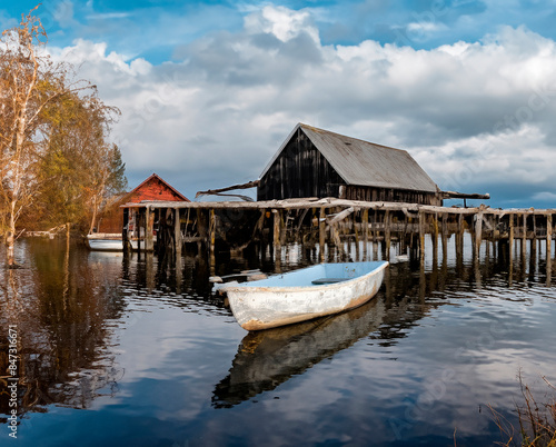 skiff floating peacefully, undisturbed