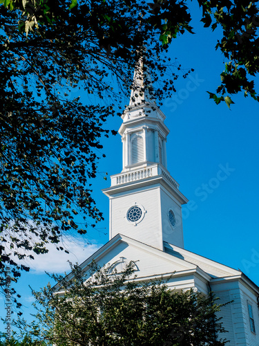 White Church Steeple Tree View With Blue Skies