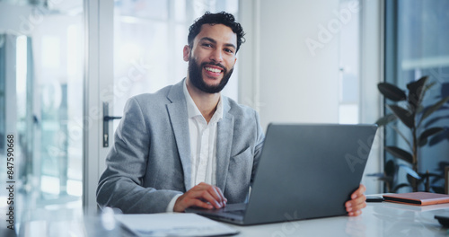 Man, laptop and portrait in boardroom with smile, documents and ready for meeting at startup company. Person, computer and happy in modern office for creativity, report or proposal with paperwork