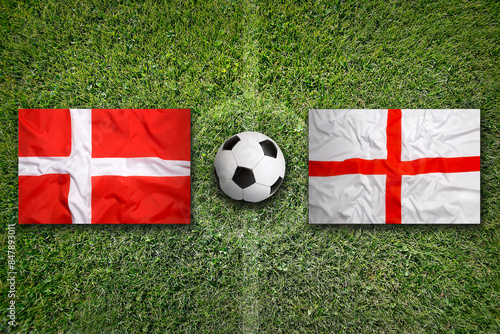 Denmark vs. England flags on soccer field