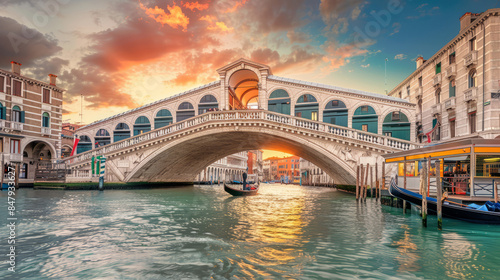 Beautiful sunset at the iconic Rialto Bridge in Venice, Italy