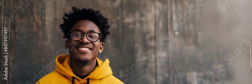 Smiling african american teenage boy in glasses, back to school and education concept