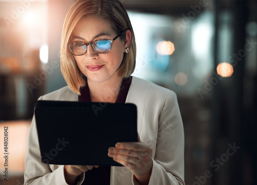 Tablet, search and business woman with glasses in night office online for planning, research or b2b client communication. Digital, feedback and manager reading social media survey or startup review