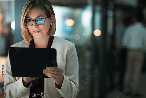 Business woman, tablet and typing in office for corporate communication, internet research and networking. Female person, technology and working late night for project planning and company email