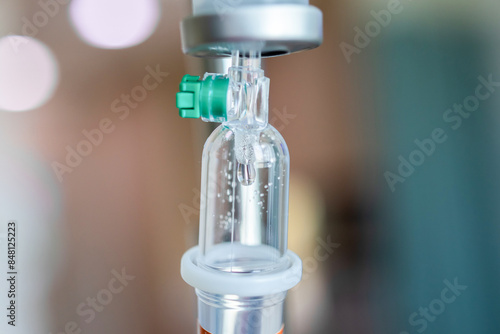 Close up medical intravenous IV drip in hospital background